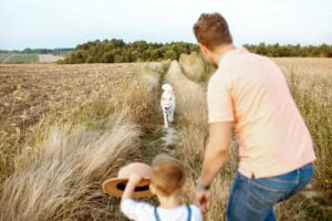 Father and son walking in the field